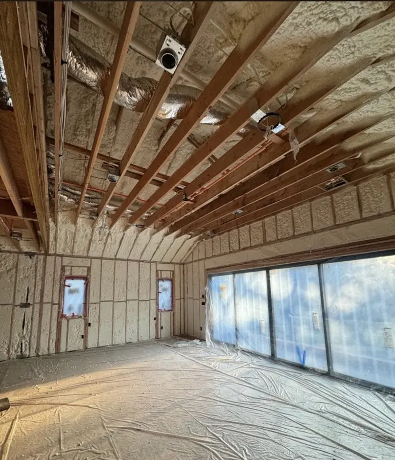 Interior walls and ceiling insulated with spray foam during new construction in Kings Grant